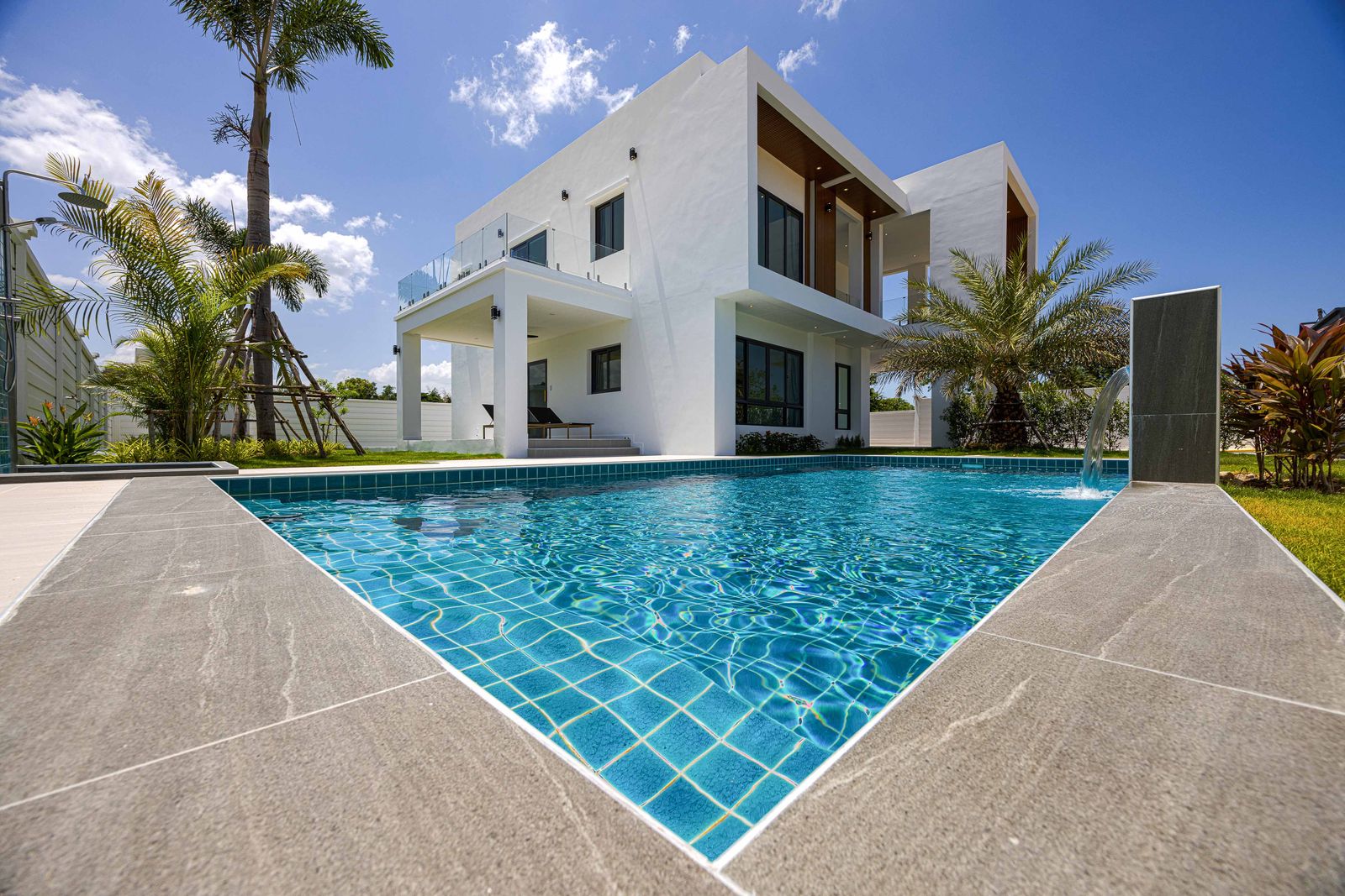 Swimming pool with stone coping and lawn, Soi 102
